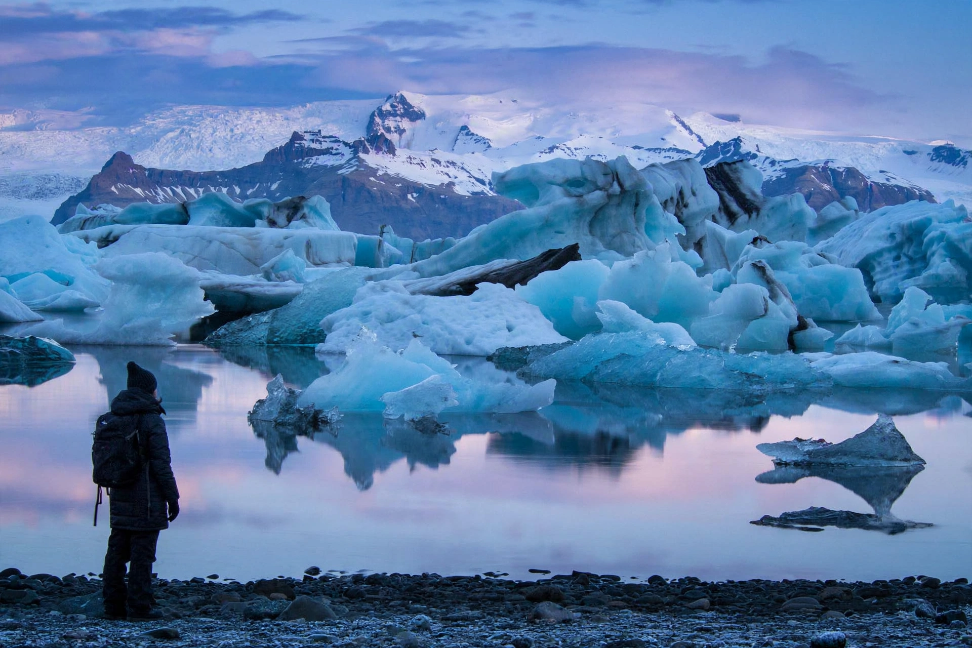 Floating blue icebergs in Jokulsarlon glacier lagoon at blue hour, Iceland